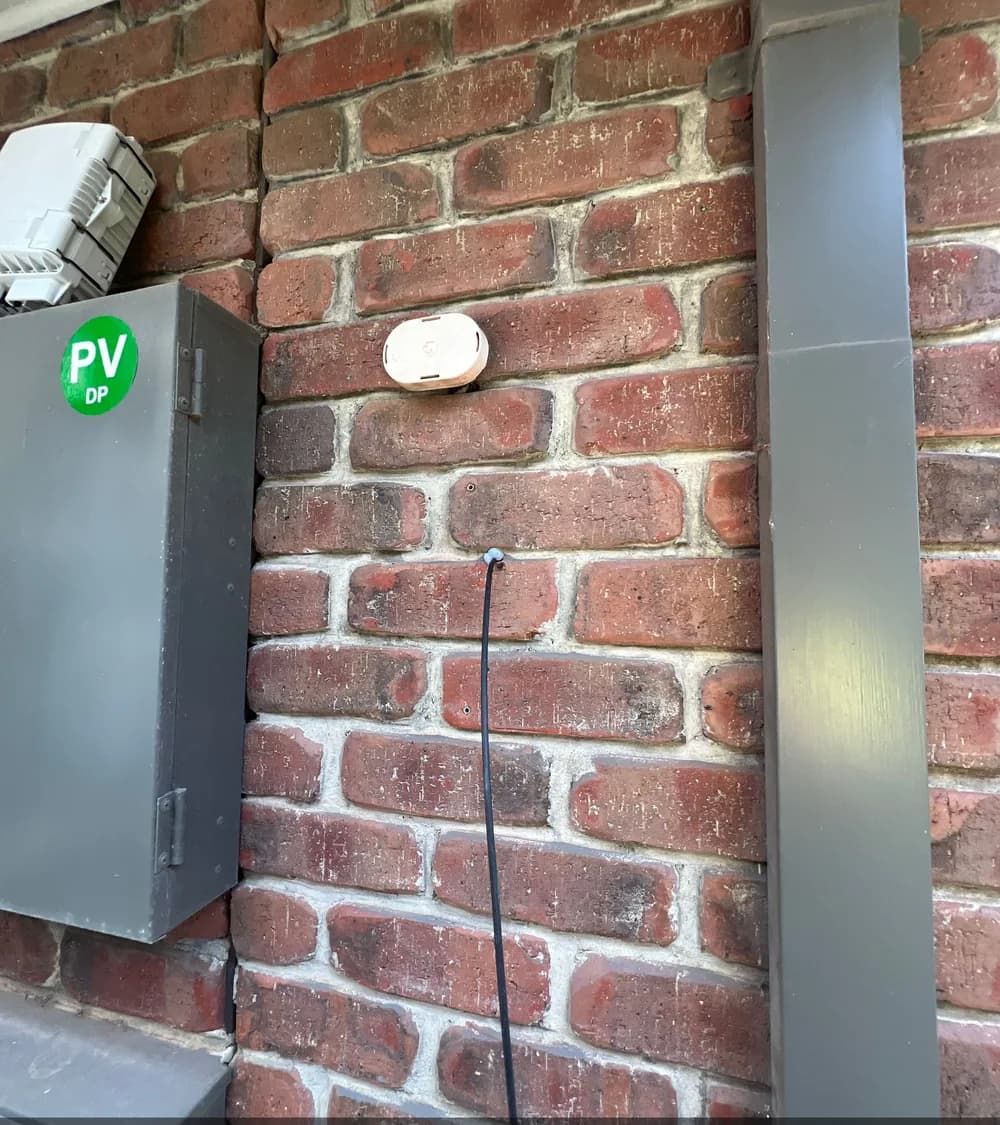 External telecommunications cable entry on a brick wall