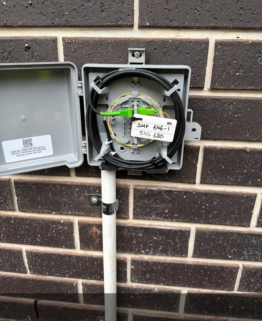 Completed fibre cable routing inside an outdoor connection enclosure