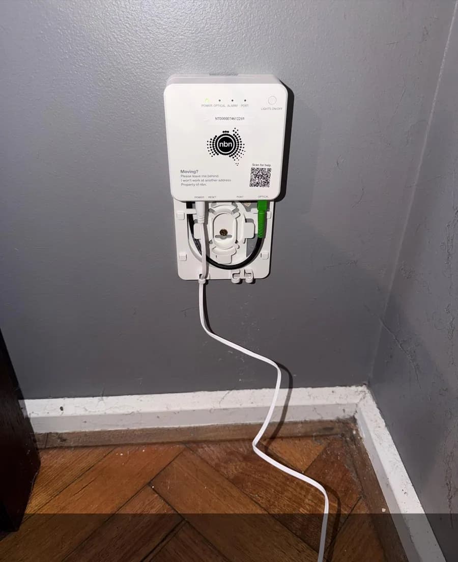 Completed NBN connection equipment installed neatly on an interior wall